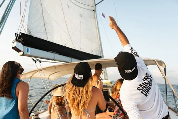 Crew studying navigation charts on deck